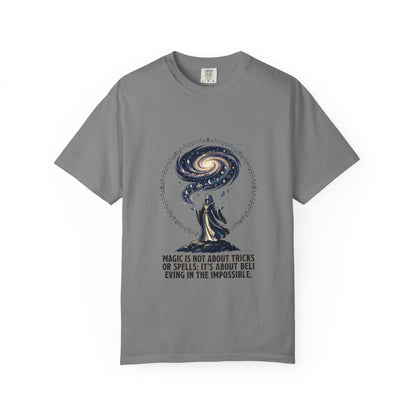 Magic Believe T‑Shirt — Wizard Gazing at Galaxy with "Magic is not about tricks or spells; it's about believing in the impossible" Quote
