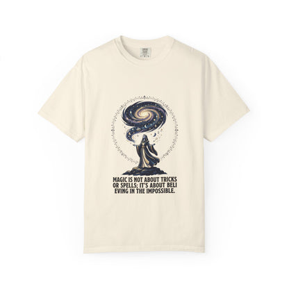 Magic Believe T‑Shirt — Wizard Gazing at Galaxy with "Magic is not about tricks or spells; it's about believing in the impossible" Quote