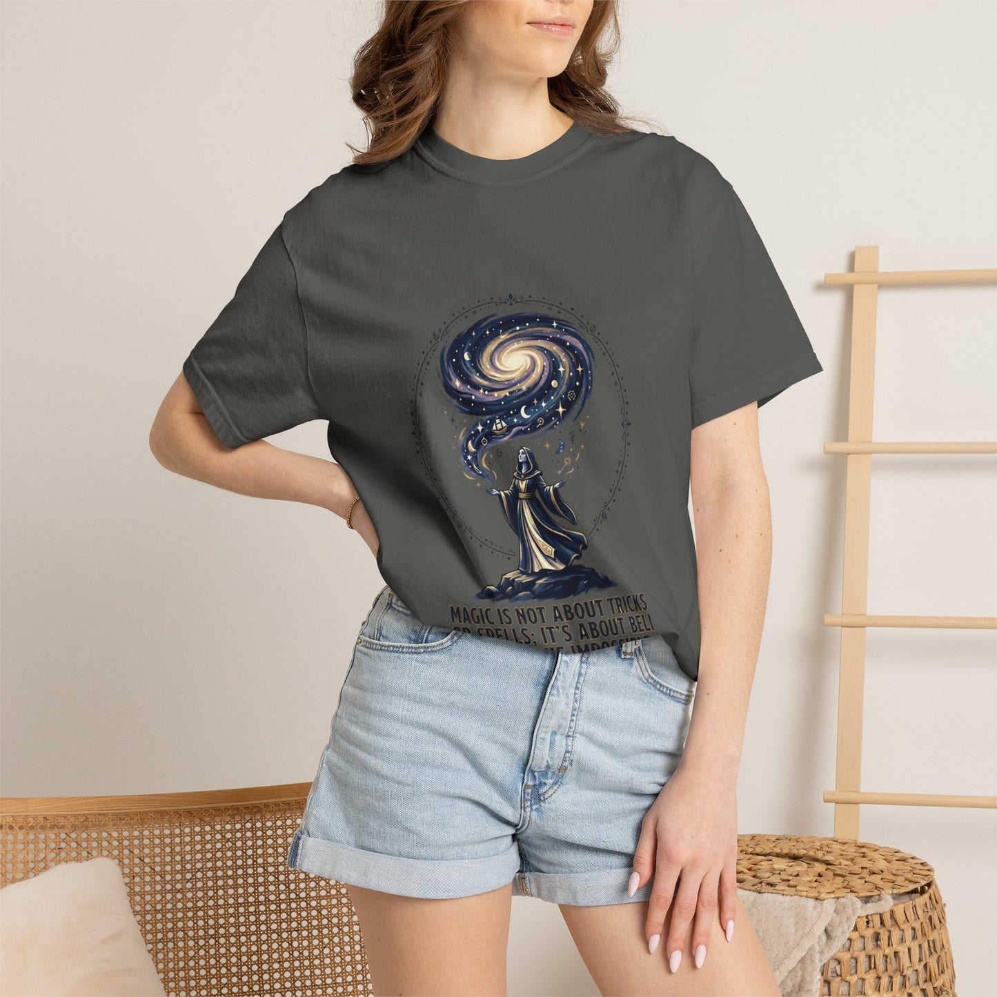 Magic Believe T‑Shirt — Wizard Gazing at Galaxy with "Magic is not about tricks or spells; it's about believing in the impossible" Quote