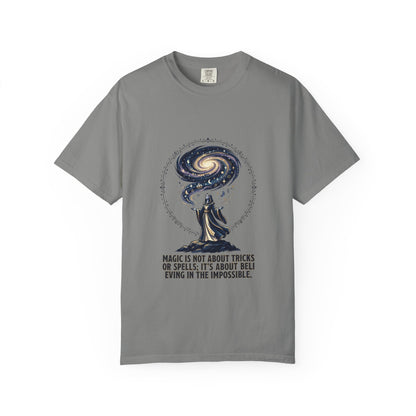 Magic Believe T‑Shirt — Wizard Gazing at Galaxy with "Magic is not about tricks or spells; it's about believing in the impossible" Quote