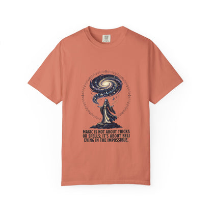 Magic Believe T‑Shirt — Wizard Gazing at Galaxy with "Magic is not about tricks or spells; it's about believing in the impossible" Quote