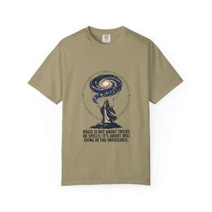 Magic Believe T‑Shirt — Wizard Gazing at Galaxy with "Magic is not about tricks or spells; it's about believing in the impossible" Quote