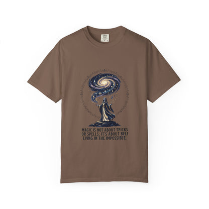 Magic Believe T‑Shirt — Wizard Gazing at Galaxy with "Magic is not about tricks or spells; it's about believing in the impossible" Quote
