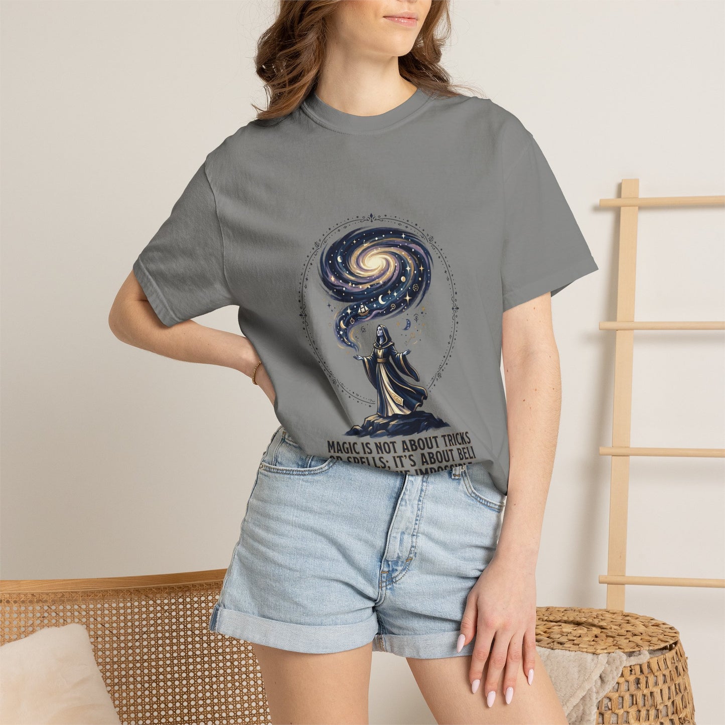 Magic Believe T‑Shirt — Wizard Gazing at Galaxy with "Magic is not about tricks or spells; it's about believing in the impossible" Quote