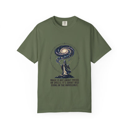 Magic Believe T‑Shirt — Wizard Gazing at Galaxy with "Magic is not about tricks or spells; it's about believing in the impossible" Quote
