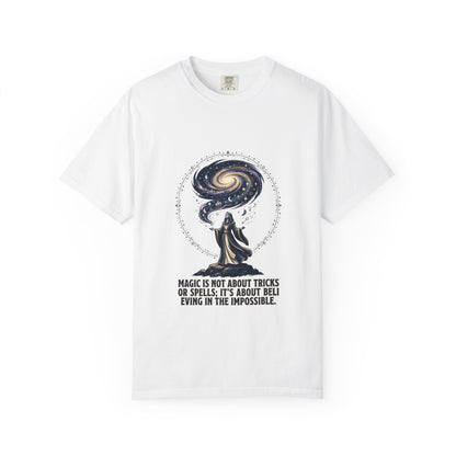 Magic Believe T‑Shirt — Wizard Gazing at Galaxy with "Magic is not about tricks or spells; it's about believing in the impossible" Quote