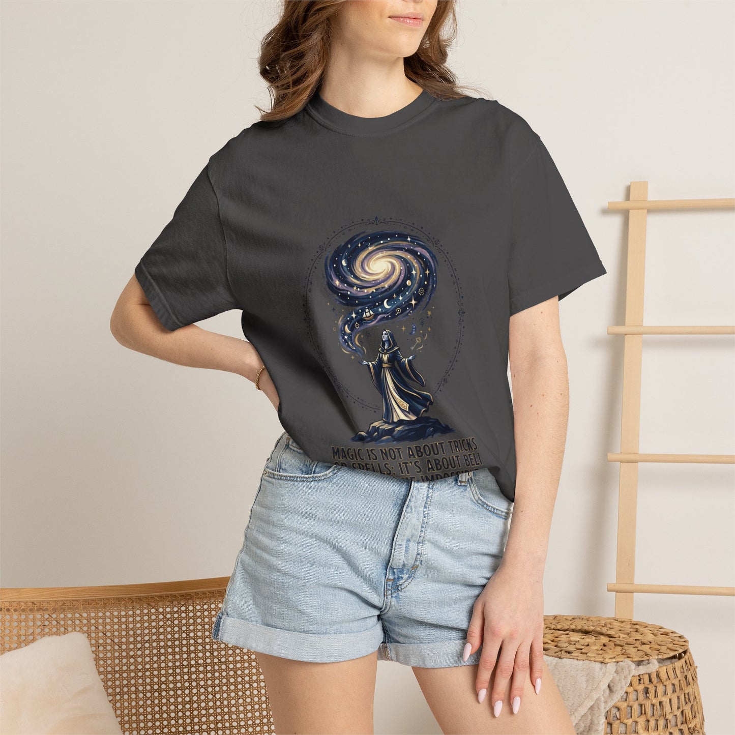 Magic Believe T‑Shirt — Wizard Gazing at Galaxy with "Magic is not about tricks or spells; it's about believing in the impossible" Quote