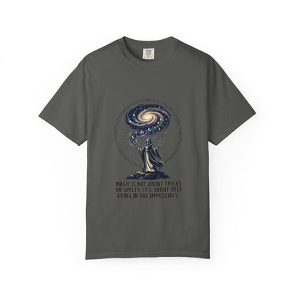 Magic Believe T‑Shirt — Wizard Gazing at Galaxy with "Magic is not about tricks or spells; it's about believing in the impossible" Quote