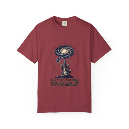 Magic Believe T‑Shirt — Wizard Gazing at Galaxy with "Magic is not about tricks or spells; it's about believing in the impossible" Quote